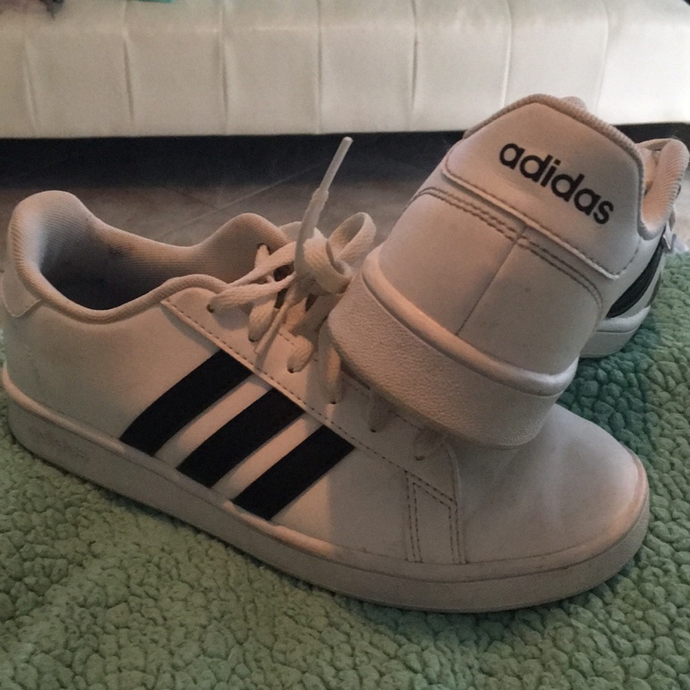 Adidas shoes with black stripes